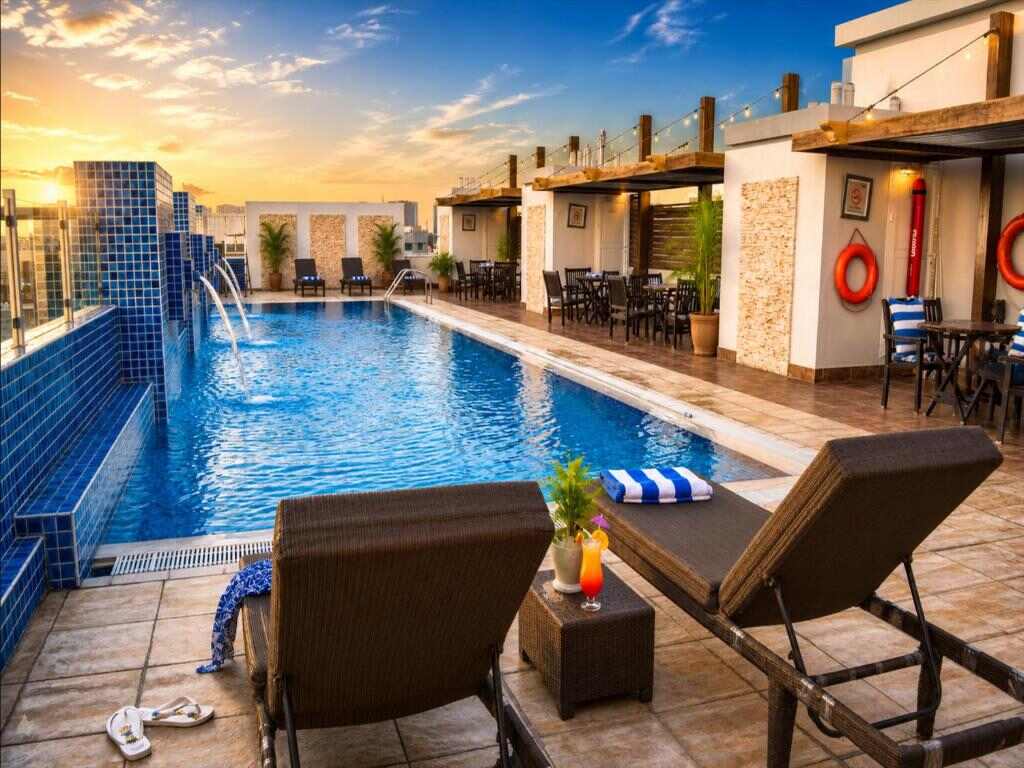 Rooftop swimming pool and sun deck at Tulip Hotel Apartments in Dubai